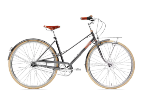 Ein elegantes creme cycles caferacer Stadtrad mit klassischem Rahmen in der Seitenansicht vor einem neutralen Hintergrund.