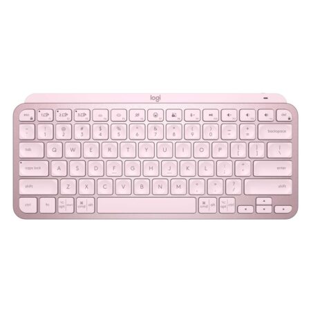 Die kompakte rosa Logitech MX Keys Mini kabellose tastatur mit leuchtenden Tasten auf einem hellen Schreibtisch.